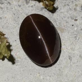 Натуральный коричневый cat's eye scapolite 2,16 карата огранка овал, полупрозрачный