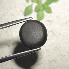 Натуральный чёрный cat's eye scapolite 3,23 карата огранка круг, непрозрачный