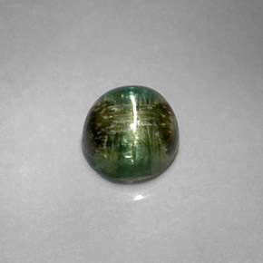 Натуральный зелёный cat's eye tourmaline 1,20 карата огранка круг, непрозрачный