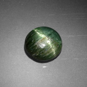 Натуральный зелёный cat's eye tourmaline 0,87 карата огранка круг, непрозрачный
