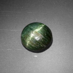 Натуральный зелёный cat's eye tourmaline 0,87 карата огранка круг, непрозрачный