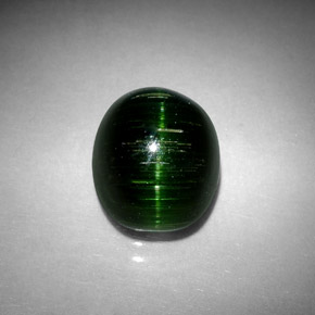 Натуральный зелёный cat's eye tourmaline 4,67 карата огранка овал, непрозрачный