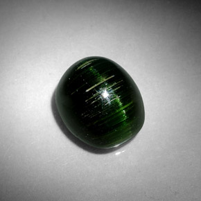 Натуральный зелёный cat's eye tourmaline 4,67 карата огранка овал, непрозрачный
