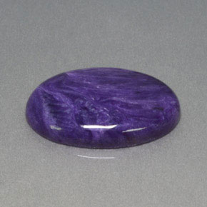 Натуральный лиловый чароит 11,14 карата огранка овал, непрозрачный