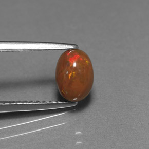 0.69 карата, натуральный Многоцветный Шоколадный опал, Огранка Овал, Непрозрачный