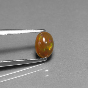 0.54 карата, натуральный Многоцветный Шоколадный опал, Огранка Овал, Непрозрачный
