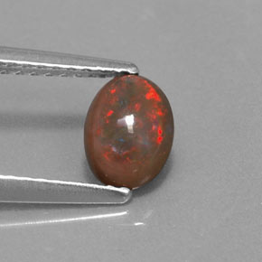 0.41 карата, натуральный Многоцветный Шоколадный опал, Огранка Овал, Полупрозрачный