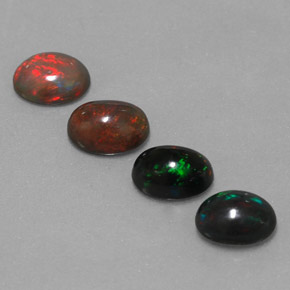 Натуральный многоцветный шоколадный опал  карата огранка овал, непрозрачный