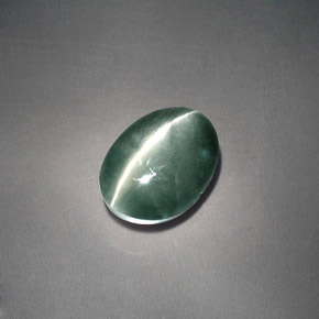 Натуральный зелёный chrysoberyl cat's eye 3,05 карата огранка овал, непрозрачный