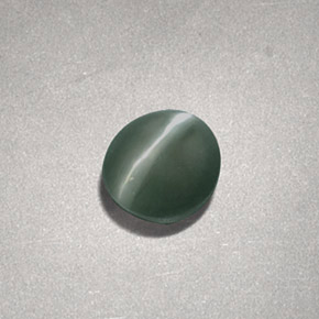 Натуральный зелёный chrysoberyl cat's eye 0,73 карата огранка овал, непрозрачный