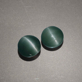 Натуральный зелёный chrysoberyl cat's eye  карата огранка круг, непрозрачный