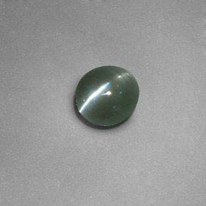 Натуральный зелёный chrysoberyl cat's eye 0,71 карата огранка овал, полупрозрачный