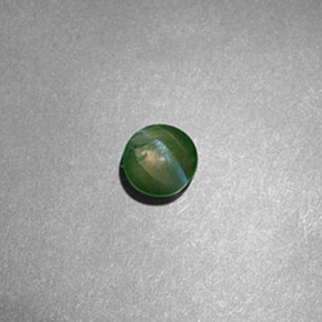 Натуральный зелёный chrysoberyl cat's eye 0,60 карата огранка круг, полупрозрачный