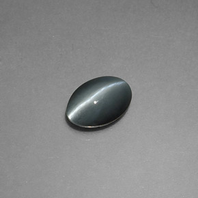 Натуральный серый chrysoberyl cat's eye 0,65 карата огранка овал, непрозрачный