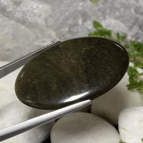 31.63 карата, натуральный Золотой блеск черный Обсидиан, Огранка Овал, Непрозрачный