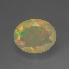 Натуральный многоцветный опал 1,34 карата огранка овал, полупрозрачный
