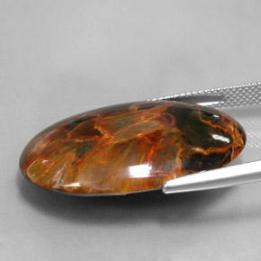 Натуральный многоцветный питерсит 24,67 карата огранка овал, непрозрачный