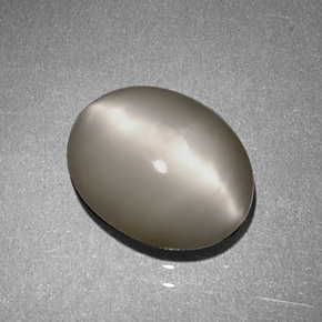 Натуральный кремовый quartz cat's eye 1,97 карата огранка овал, непрозрачный