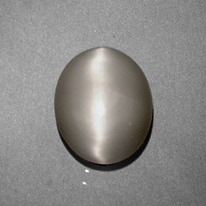 Натуральный кремовый quartz cat's eye 1,97 карата огранка овал, непрозрачный