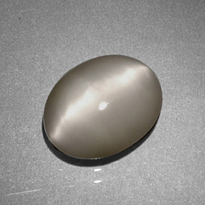 Натуральный кремовый quartz cat's eye 1,97 карата огранка овал, непрозрачный
