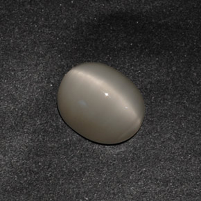 Натуральный серый quartz cat's eye 3,42 карата огранка овал, непрозрачный