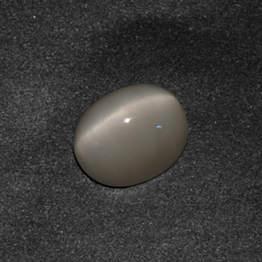 Натуральный серый quartz cat's eye 3,42 карата огранка овал, непрозрачный