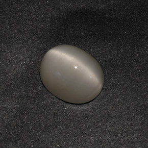 Натуральный серый quartz cat's eye 3,42 карата огранка овал, непрозрачный