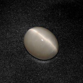 Натуральный серый quartz cat's eye 3,19 карата огранка овал, непрозрачный