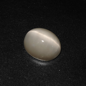 Натуральный серый quartz cat's eye 3,19 карата огранка овал, непрозрачный