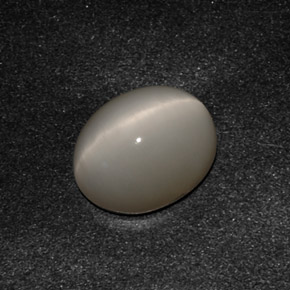 Натуральный серый quartz cat's eye 3,07 карата огранка овал, непрозрачный