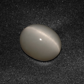 Натуральный серый quartz cat's eye 3,07 карата огранка овал, непрозрачный