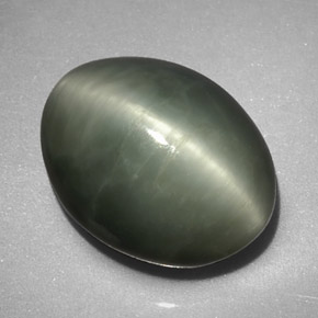 Натуральный зелёный quartz cat's eye 7,74 карата огранка овал, непрозрачный