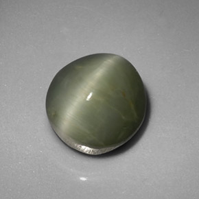 Натуральный зелёный quartz cat's eye 5,45 карата огранка овал, непрозрачный