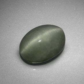 Натуральный зелёный quartz cat's eye 6,41 карата огранка овал, непрозрачный