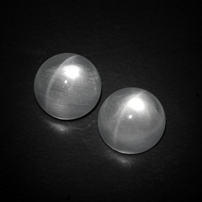 Натуральный белый quartz cat's eye  карата огранка круг, прозрачный