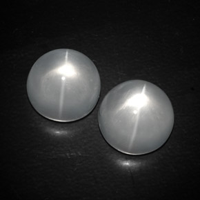 Натуральный белый quartz cat's eye 13,03 карата огранка круг, прозрачный
