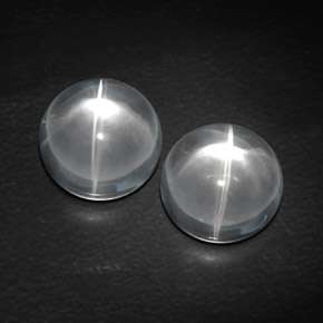 Натуральный белый quartz cat's eye  карата огранка круг, прозрачный