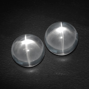 Натуральный белый quartz cat's eye  карата огранка круг, прозрачный