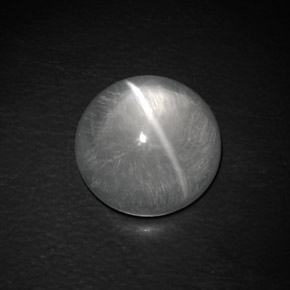 Натуральный белый quartz cat's eye 9,02 карата огранка круг, прозрачный
