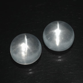 Натуральный белый quartz cat's eye  карата огранка круг, прозрачный