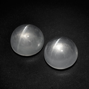 Натуральный белый quartz cat's eye  карата огранка круг, прозрачный