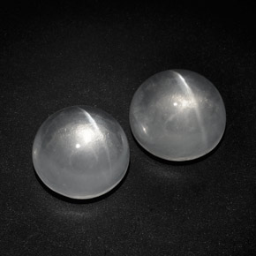Натуральный белый quartz cat's eye  карата огранка круг, прозрачный