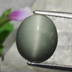 Натуральный зелёный quartz cat's eye 3,01 карата огранка овал, непрозрачный