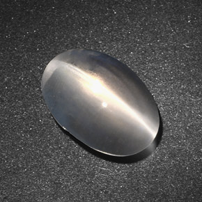 Натуральный серый sillimanite cat's eye 7,34 карата огранка овал, полупрозрачный