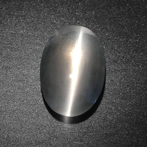 Натуральный серый sillimanite cat's eye 7,34 карата огранка овал, полупрозрачный