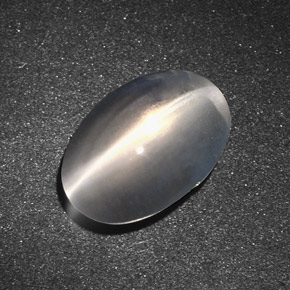 Натуральный серый sillimanite cat's eye 7,34 карата огранка овал, полупрозрачный