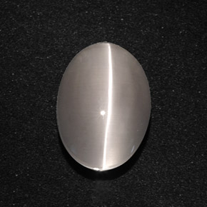 Натуральный серый sillimanite cat's eye 5,66 карата огранка овал, полупрозрачный
