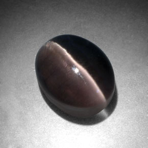 Натуральный серый sillimanite cat's eye 3,96 карата огранка овал, полупрозрачный