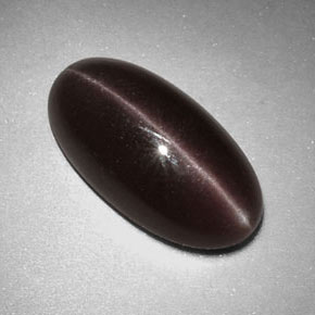 Натуральный коричневый sillimanite cat's eye 7,07 карата огранка овал, непрозрачный