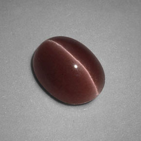 Натуральный коричневый sillimanite cat's eye 1,98 карата огранка овал, непрозрачный